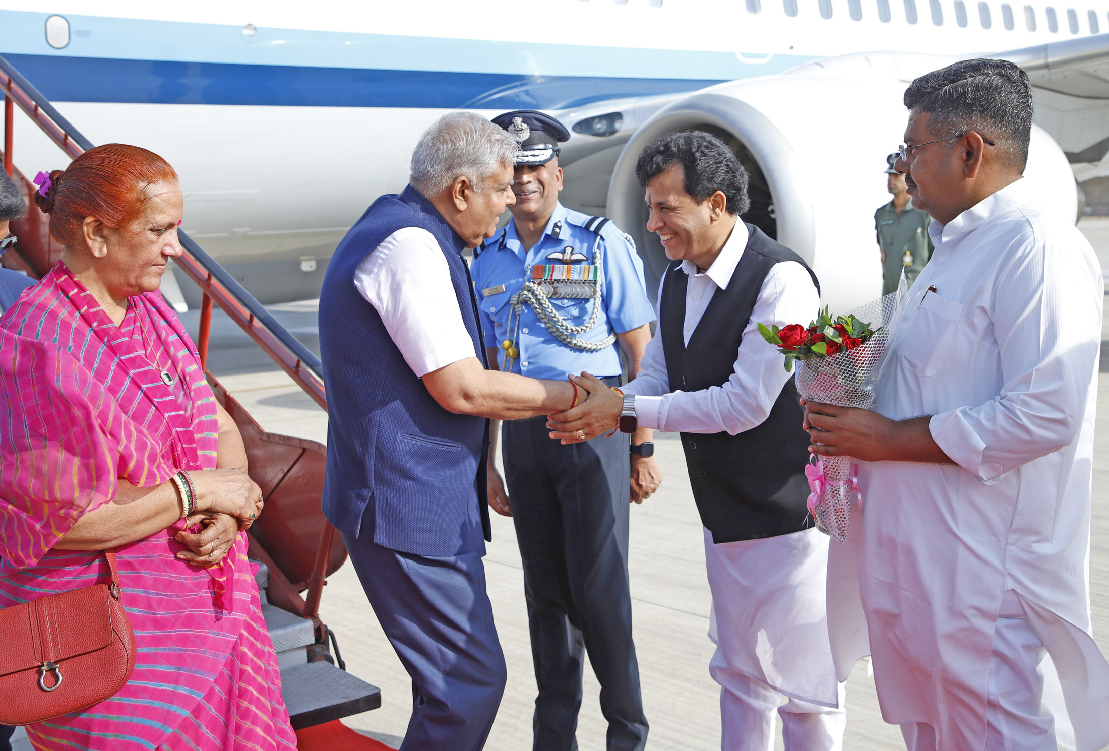 The Vice-President, Shri Jagdeep Dhankhar and Dr Sudesh Dhankhar being welcomed by Union Minister, Shri Kailash Choudhary and Minister of Rajasthan Government, Shri Bhanwar Singh Bhati on their arrival in Suratgarh, Rajasthan on October 7, 2023.