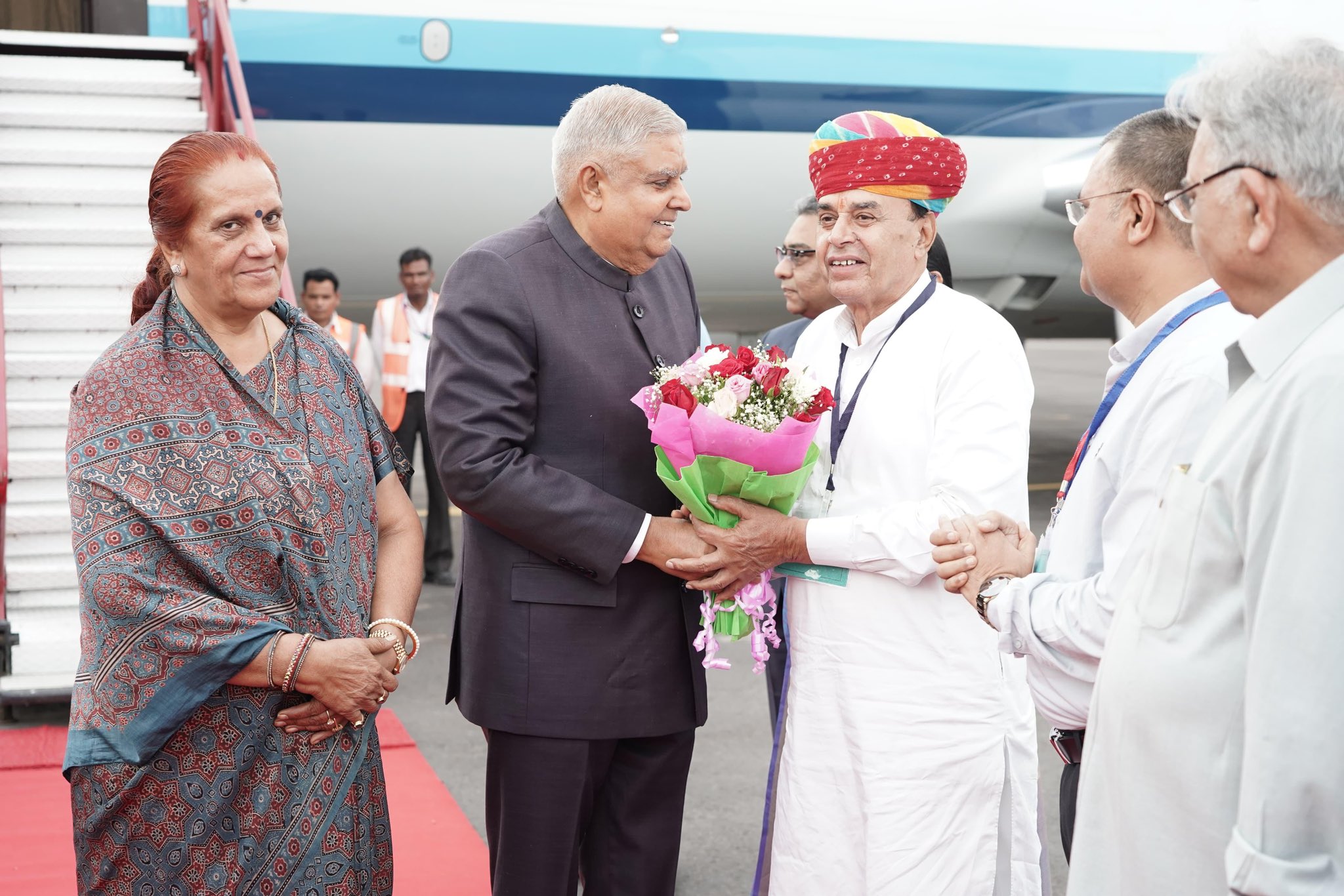 The Vice-President, Shri Jagdeep Dhankhar and Dr. Sudesh Dhankhar being welcomed by the Chief Justice of Rajasthan High Court, Shri M.M. Shrivastava, and Law Minister, Government of Rajasthan, Shri Jogaram Patel and other dignitaries on their arrival in Jodhpur, Rajasthan on August 9, 2024.