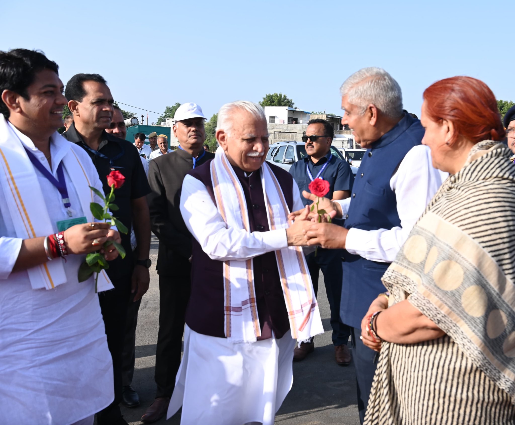  The Vice-President, Shri Jagdeep Dhankhar and Dr. Sudesh Dhankhar  being welcomed by Shri Manohar Lal, Union Minister of Housing and Urban Affairs; and Power, Shri Avinash Gehlot, Minister, Government of Rajasthan and other dignitaries on their arrival i