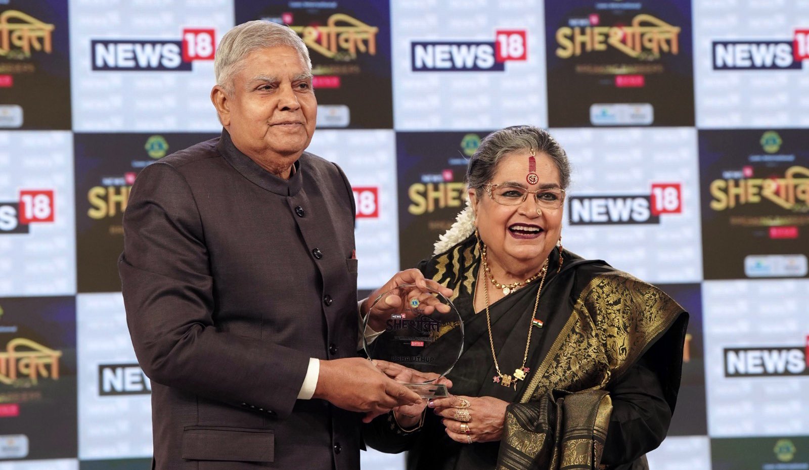 The Vice-President, Shri Jagdeep Dhankhar felicitating Women Achievers, Ms. Avani Lekhara, Paralympian, Ms. Nouf Marwaai, President, Saudi Yoga Committee and Ms. Usha Uthup, Singer, at 'News18 SheShakti 2024' in New Delhi on September 16, 2024.