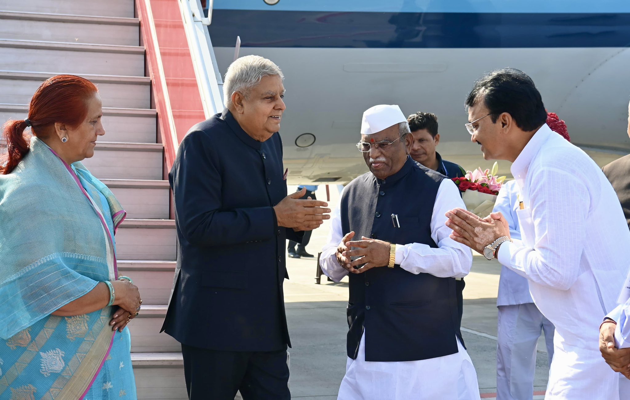 The Vice-President, Shri Jagdeep Dhankhar and Dr. Sudesh Dhankhar being welcomed by Shri Haribhau Kisanrao Bagde, Governor of Rajasthan, Shri Prem Chand Bairwa, Deputy Chief Minister of Rajasthan, Shri Kanhaiya Lal Choudhary, Minister Govt. of Rajasthan, Shri Ghanshyam Tiwari, Member of Parliament (Rajya Sabha) and other dignitaries on their arrival in Jaipur, Rajasthan on October 19, 2024.