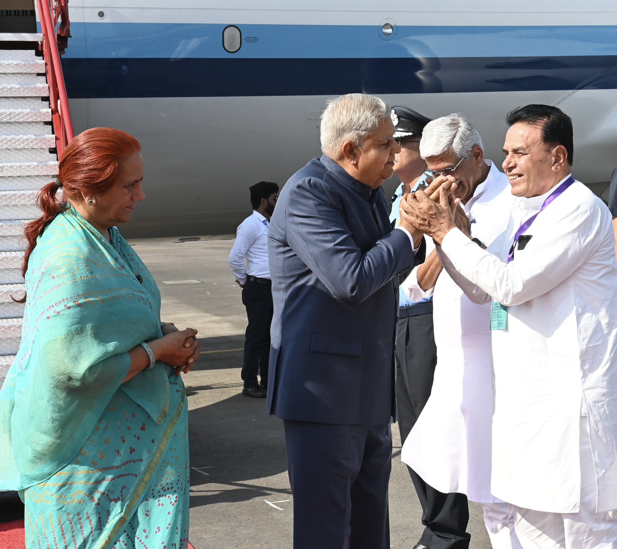 The Vice-President, Shri Jagdeep Dhankhar and Dr. Sudesh Dhankhar being welcomed by Shri Gajendra Singh Shekhawat, Union Minister of Culture and Tourism, Shri Jogaram Patel, Minister Govt. of Rajasthan and other dignitaries on their arrival in Jodhpur, Rajasthan on October 26, 2024. 