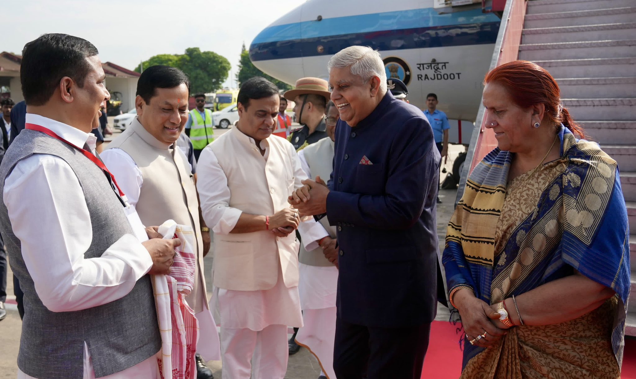 The Vice-President, Shri Jagdeep Dhankhar and Dr. Sudesh Dhankhar being welcomed by Shri Lakshman Acharya, Governor of Assam, Shri Himanta Biswa Sarma, Chief Minister of Assam, Shri Sarbananda Sonowal, Union Minister, Shri Jayanta Mallabaruah, Minister, Government of Assam and other dignitaries on their arrival in Guwahati, Assam on October 27, 2024.