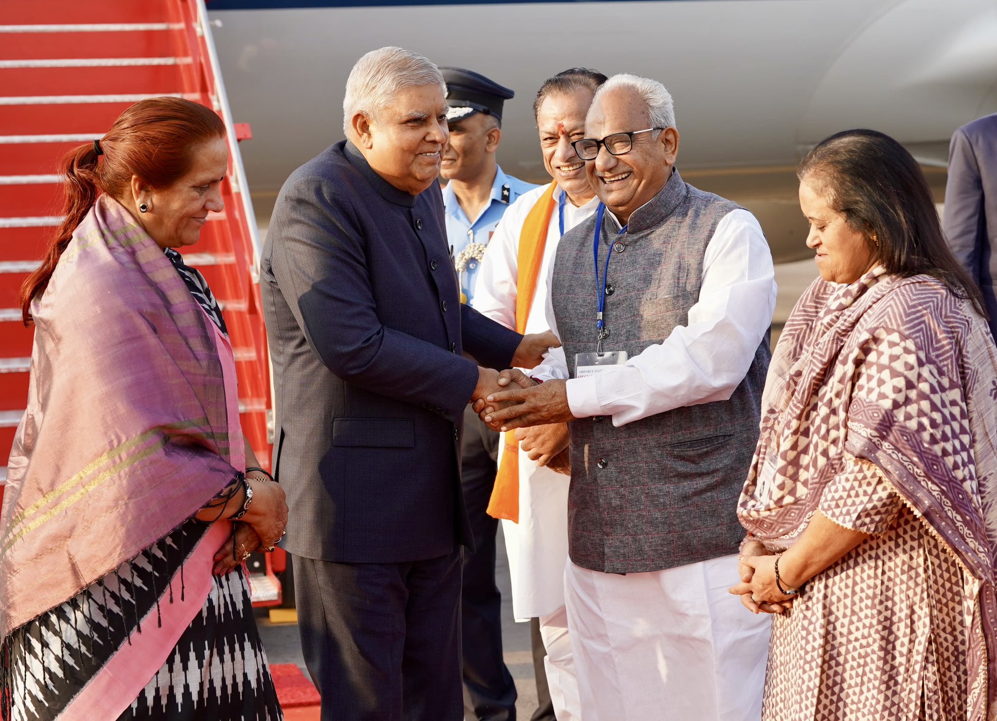 The Vice-President, Shri Jagdeep Dhankhar and Dr. Sudesh Dhankhar being welcomed by Shri Joraram Kumawat, Minister Government of Rajasthan, Shri Rajendra Gehlot, Member of Parliament (Rajya Sabha) and other dignitaries on their arrival in Jodhpur, Rajasthan on November 23, 2024.