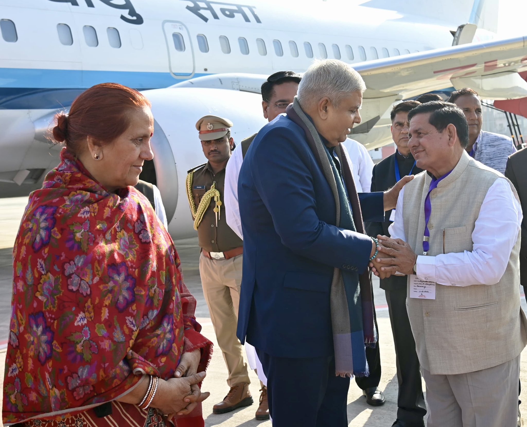 The Vice-President, Shri Jagdeep Dhankhar and Dr. Sudesh Dhankhar being welcomed by Shri Haribhau Kisanrao Bagde, Governor of Rajasthan, Shri Suresh Singh Rawat, Minister, Government of Rajasthan along with other dignitaries on their arrival in Jaipur, Rajasthan on December 11, 2024. 