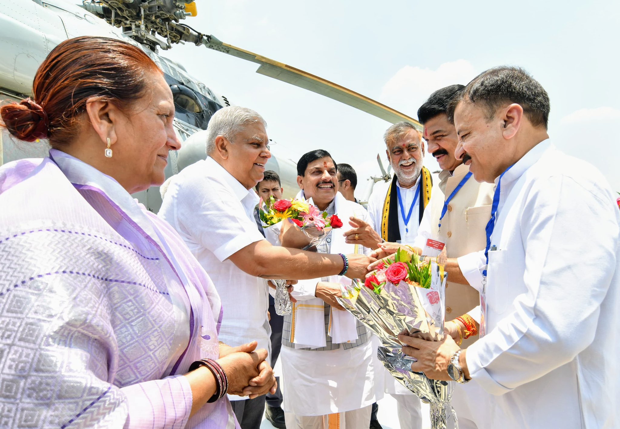 The Vice-President, Shri Jagdeep Dhankhar and Dr. Sudesh Dhankhar being welcomed by Shri Mangubhai C. Patel, Governor of Madhya Pradesh, Shri Mohan Yadav, Chief Minister of Madhya Pradesh, Shri Prahlad Singh Patel and Shri Uday Pratap Singh, Ministers, Government of Madhya Pradesh, and other dignitaries on their arrival in Narsinghpur, Madhya Pradesh on May 26, 2025. 