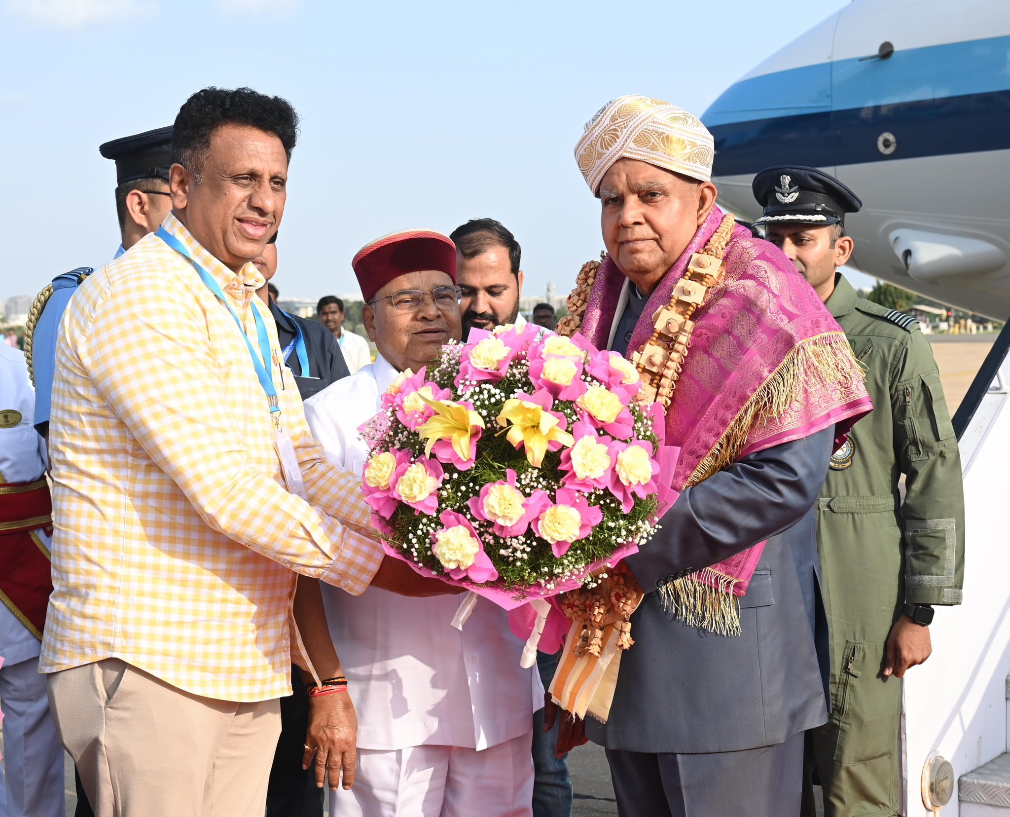 The Vice-President, Shri Jagdeep Dhankhar being welcomed by Shri Thaawarchand Gehlot, Governor of Karnataka, Dr M. C. Sudhakar, Minister for Higher Education, Govt. of Karnataka, and other dignitaries on his arrival in Bengaluru, Karnataka on June 7, 2025.